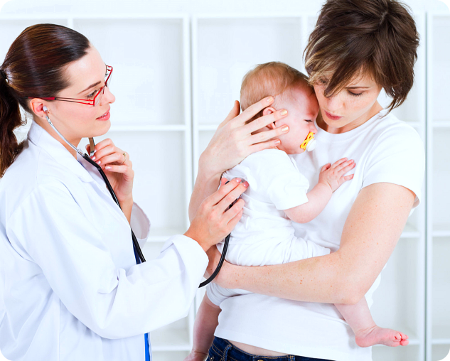 doctor checking the baby with her mother